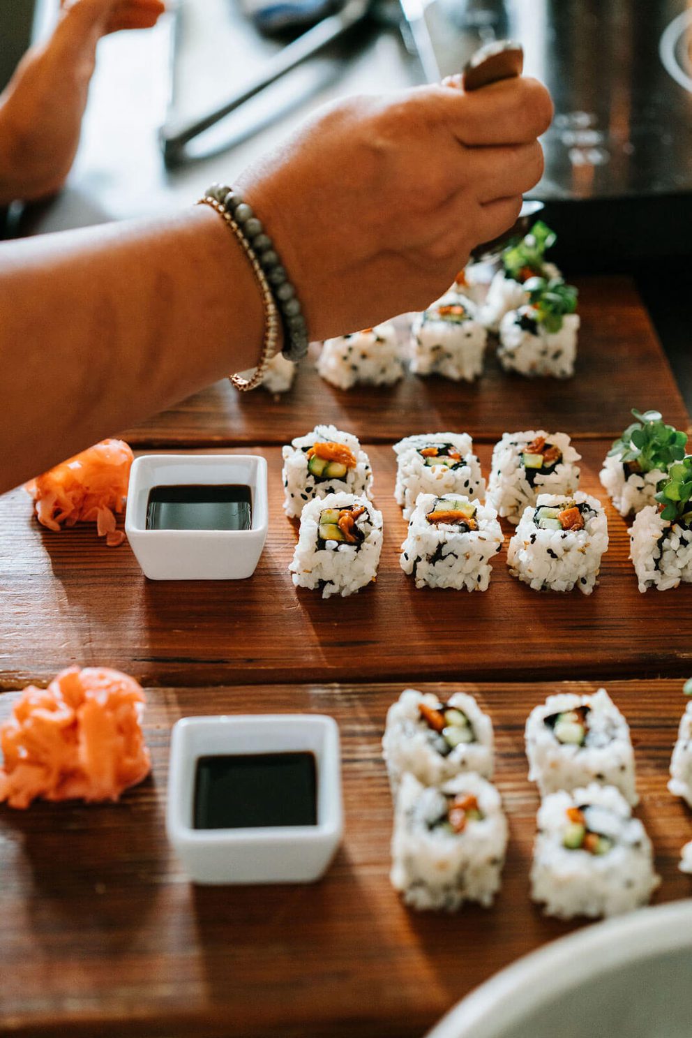 Salmon sushi rolls on wood boards