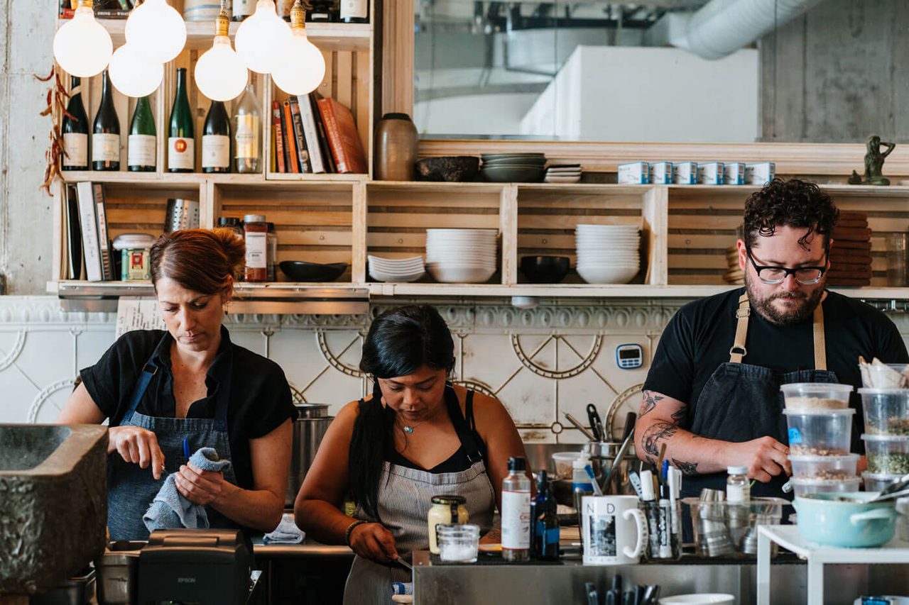Chefs cleaning the kitchen